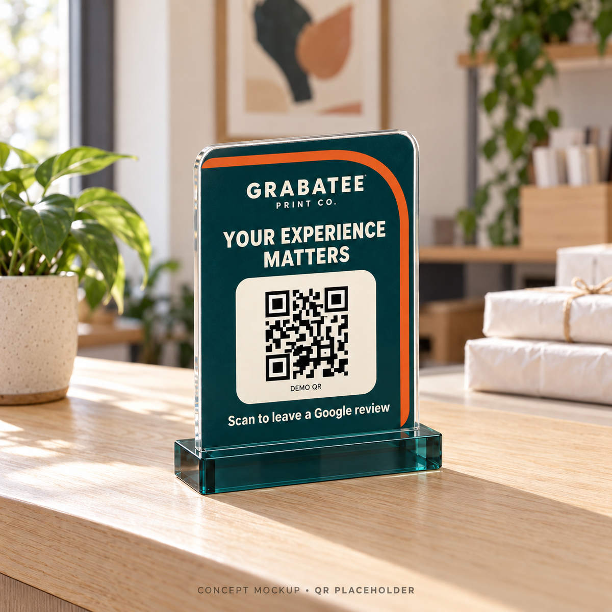 CounterCue concept mockup showing a personalized acrylic QR review sign on a shop checkout counter; placeholder QR code.